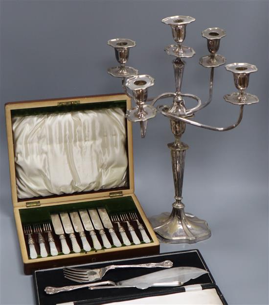 A cased plated dessert eaters, A cased pair of fish servers and plated candlesticks